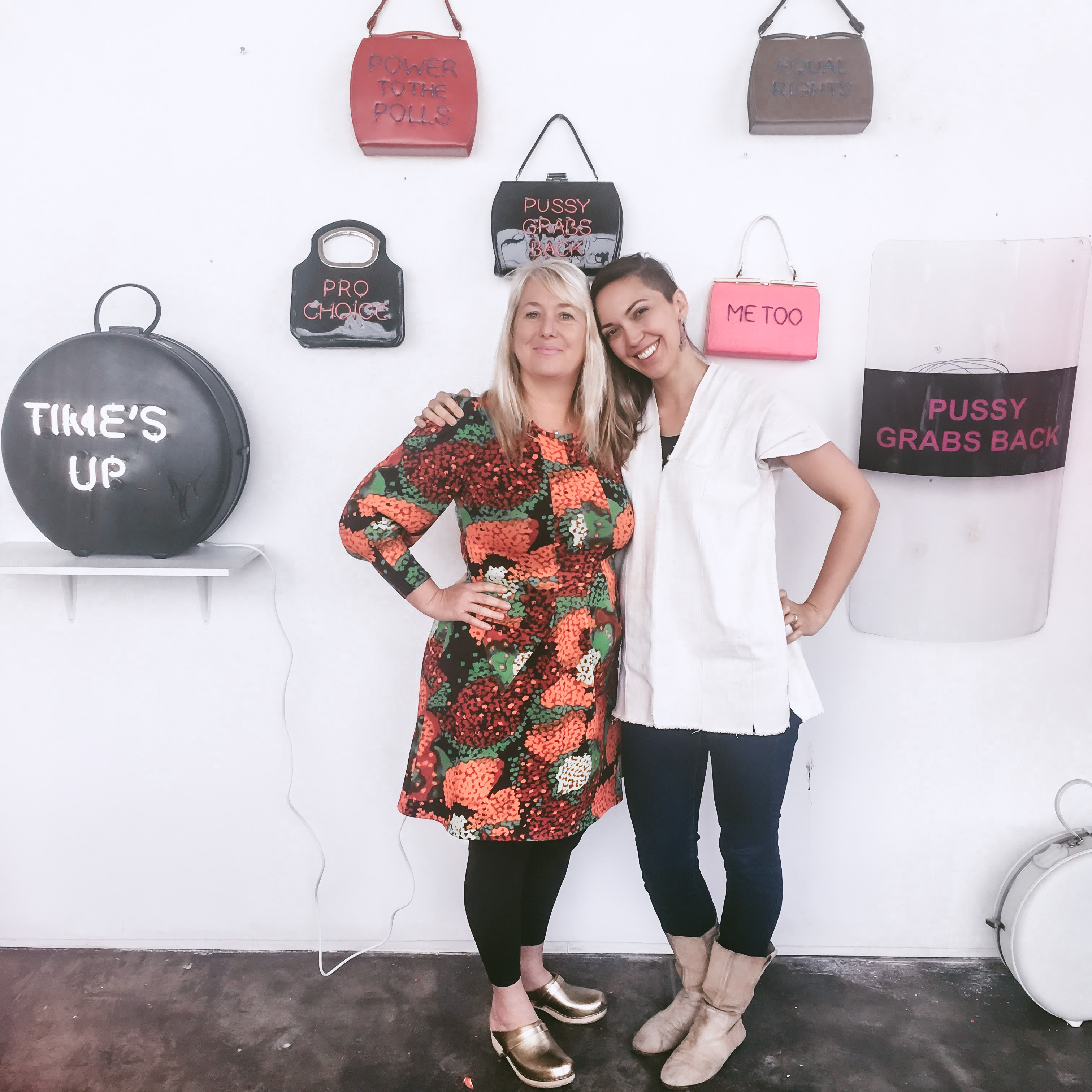 Michele & Svea in front of the "Power of the Purse" series at Faultline Studios in Oakland
